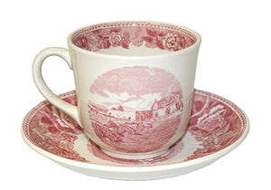 white and red teacup with fort image and saucer with red border