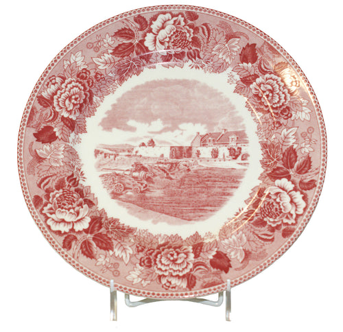 this red and white plate displays a floral design with a picture of the South Wall and South Barracks of Fort Ticonderoga centered in the middle